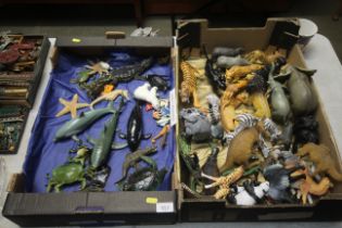 A collection of aquatic toy creatures and a jungle