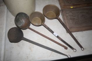 Two brass ladles, a coppered ladle and an iron lad