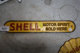 A small cast iron Shell Motor spirit sign