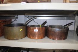 Two antique copper saucepans and a brass similar