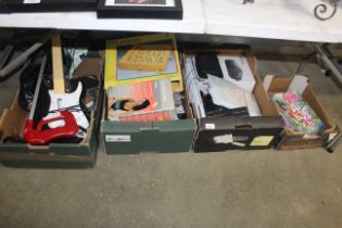 Four boxes containing children's books, toys, IT a