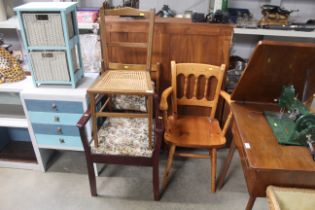 An upholstered carver chair; a pine carver chair;