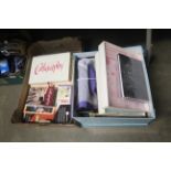 A box of various stationery, calligraphy books, a