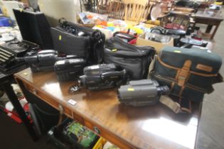 Four various camcorders, carrying bags and accesso