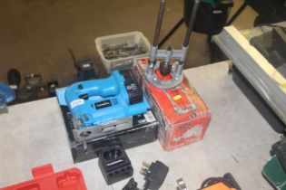 A PowerBase 732871 cordless electric jig saw as ne