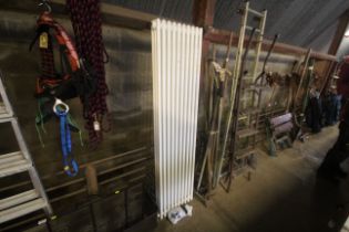 A tall radiator measuring approx. 72" x 18" x 4.5" with some fittings