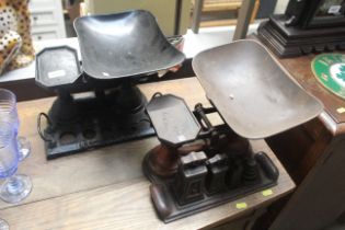 Two sets of cast iron shop scales, one set with so