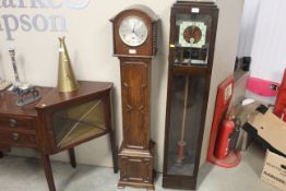 A 1930s oak cased grandmother clock with chiming m