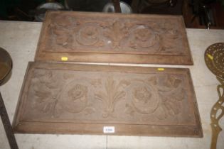 A pair of ornate carved wooden panels measuring ap