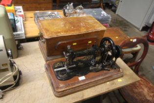 A vintage sewing machine in wooden case