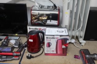 A Breville four slot toaster in original box and a Breville kettle, both with original boxes