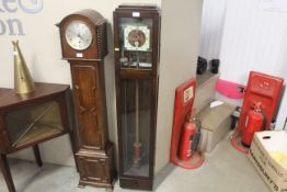 An Art Deco oak cased electric regulator clock