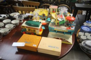 A large collection of Fisher Price toys including