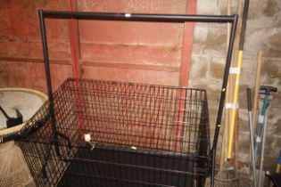 A metal clothes rail measuring approx. 60" long