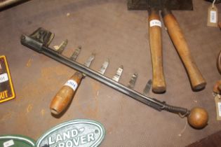 A vintage hand held hedge cutter with multi cuttin