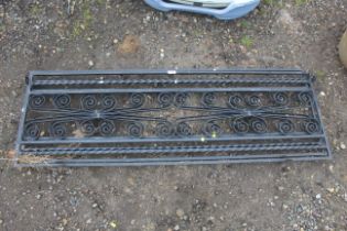 Two wrought metal wall toppers