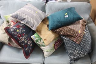 A collection of various scatter cushions