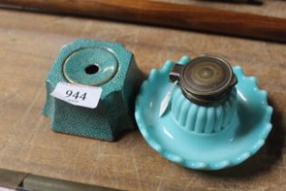 A Victorian glass inkwell with brass lid and a por