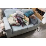 A two seater sofa, upholstered in pale blue Dralon