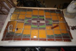 A coloured glass and leaded window panel AF