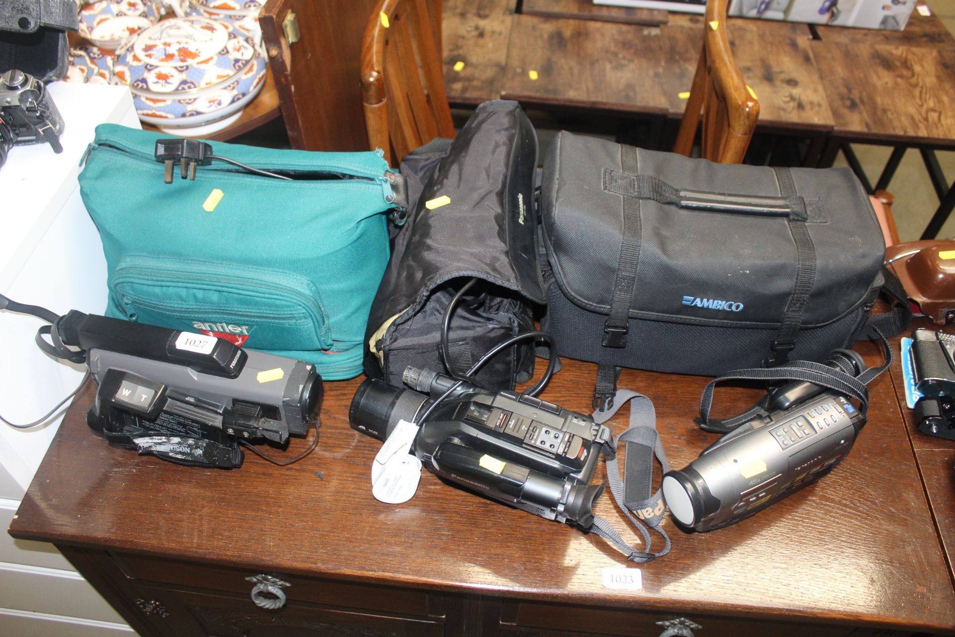 Two Panasonic camcorders and carry bags; and a Fer