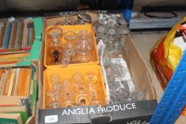 A box of various table glassware