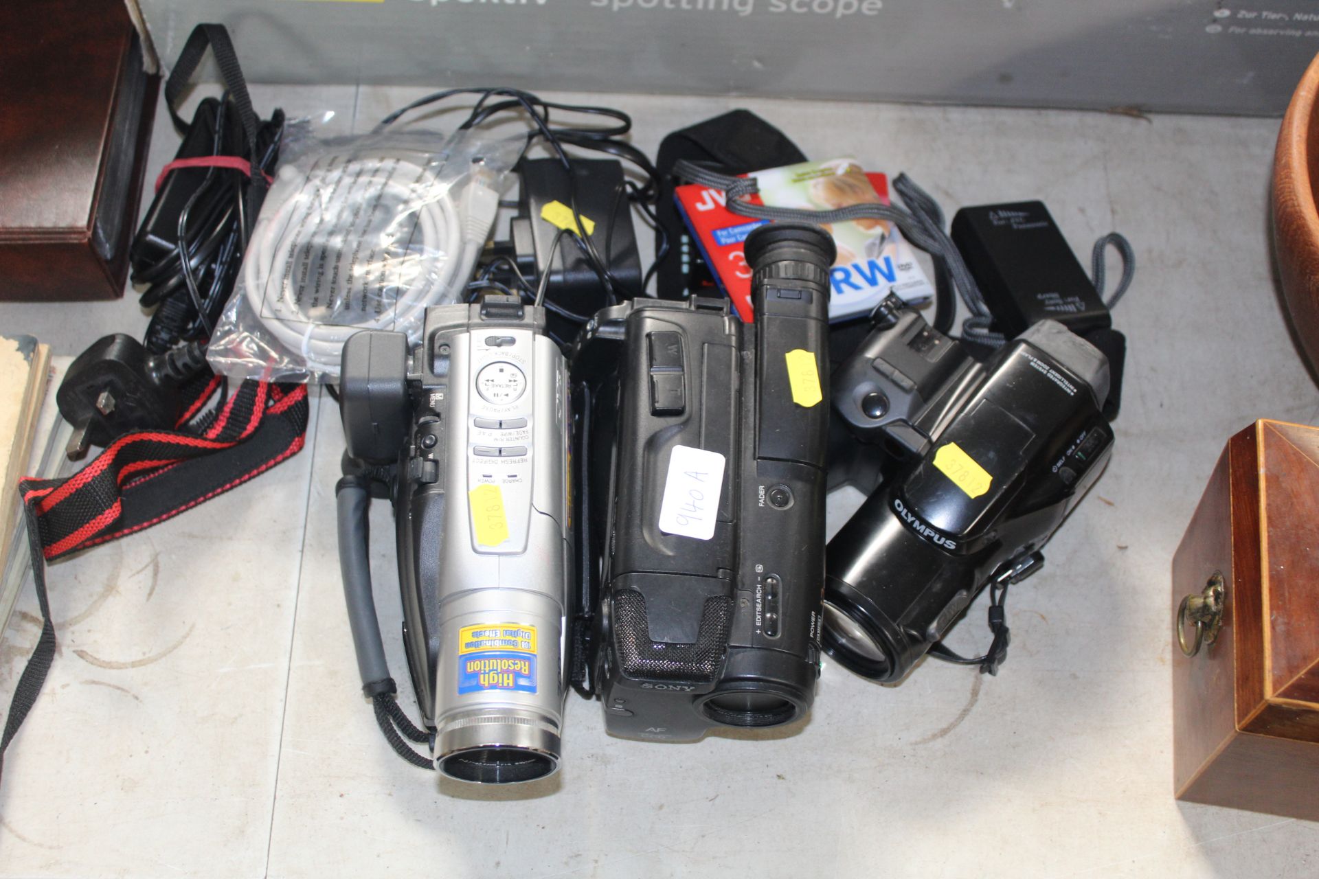 Three various camcorders and accessories