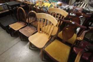 A pair of pine slat back kitchen chairs