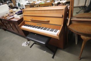 A John Brinsmead & Sons upright piano and a modern