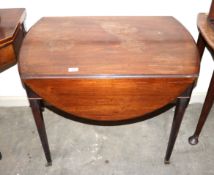 A late 18th Century mahogany oval Pembroke table, having single bow fronted end drawer raised on