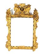 An 18th Century Italian Baroque gilt mirror frame, 81cm x 54cm in extremes; together with a later