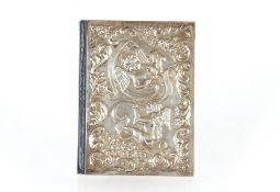A small silver mounted New Testament with cherub decoration