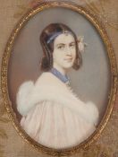A well painted miniature portrait of a young lady wearing a fur collared cape, fabric mount and gold