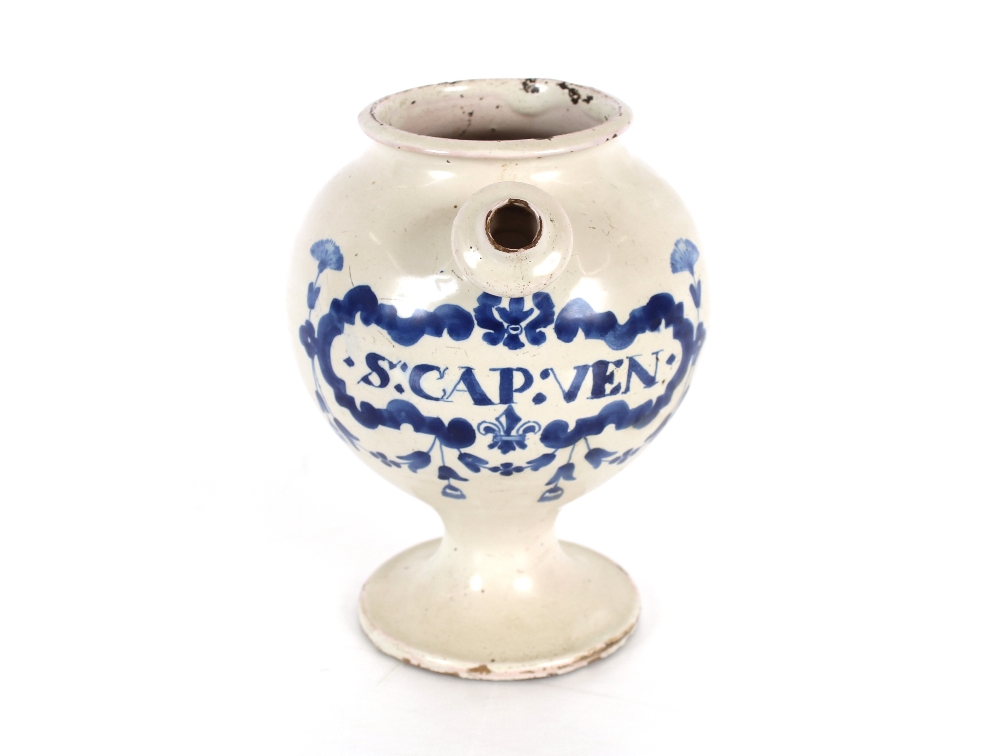 A 17th Century London Delft wet drug jar of generous baluster proportions, painted in blue with a