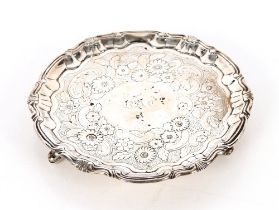 A George III silver card tray, with pie crust and shell border, foliate scroll decoration to the
