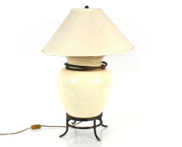 A large crackled glaze cream pottery baluster table lamp, on bronzed ring base complete with