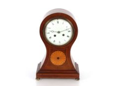 A late 19th / early 20th Century mahogany and satin wood inlaid balloon shaped mantel clock,