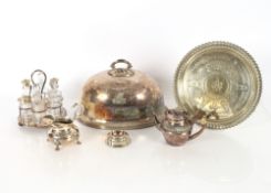 A Victorian oval plated meat dish cover; a six bottle table cruet; a plated tray and various other