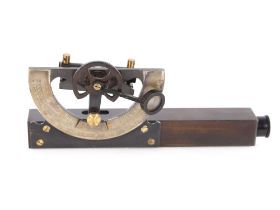 A leather cased surveying instrument and a set of Victorian postal scales and weights