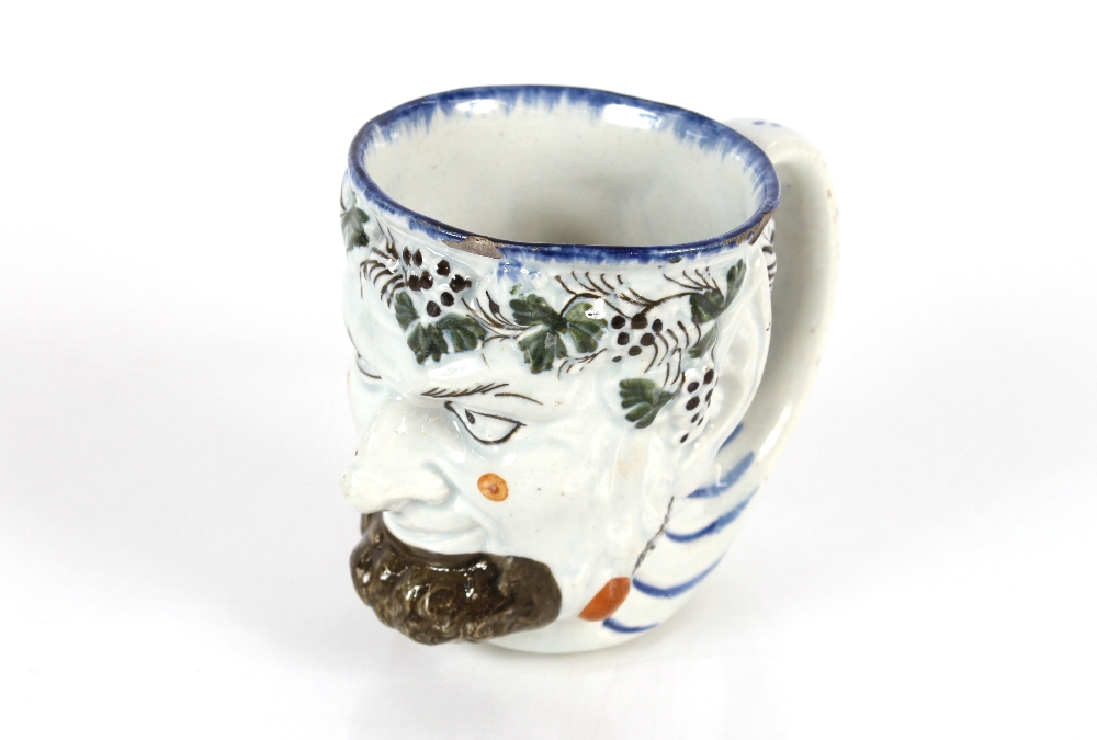 A late 18th Century Pratt ware pottery mug depicting Bacchus and a rare railwayana interest