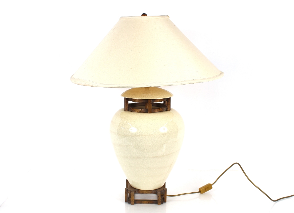 A cream crackle glazed baluster table lamp on square section base, complete with shade, 76cm high