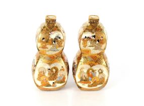 A fine pair of Japanese Satsuma double gourd shaped vases, painted with figures within panels and