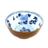 A Nanking Cargo mid-18th Century Batavia ware bowl, the exterior with café au lait glaze, the