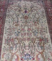 A fine 19th Century Isfahan Tree of Life patterned rug, the borders decorated birds and deer, 80"x