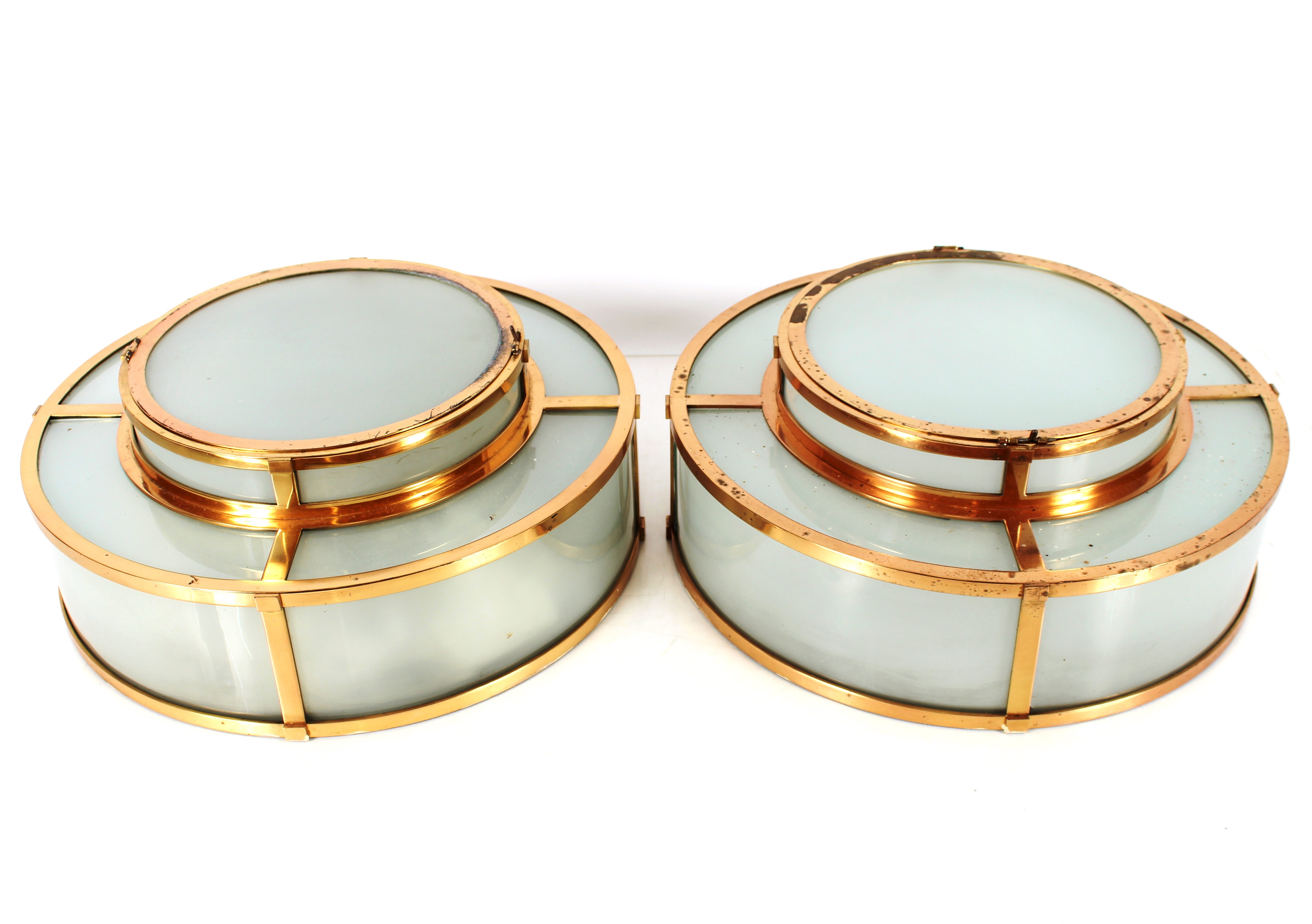 A pair of brass and opaque glass Art Deco design circular ceiling lights, 46cm dia.