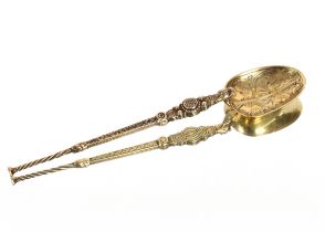 An extra large silver gilt anointing spoon, London