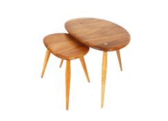 An Ercol nest of two "Pebble" coffee tables