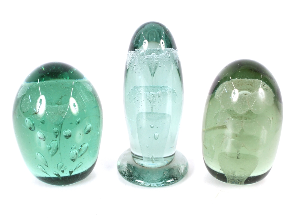 Three Victorian green glass dumps decorated flowers, the tallest 14cm high