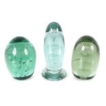 Three Victorian green glass dumps decorated flowers, the tallest 14cm high