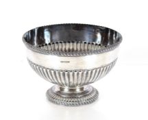 An Edwardian silver rose bowl, having gadrooned border and half fluted body decoration by Harry
